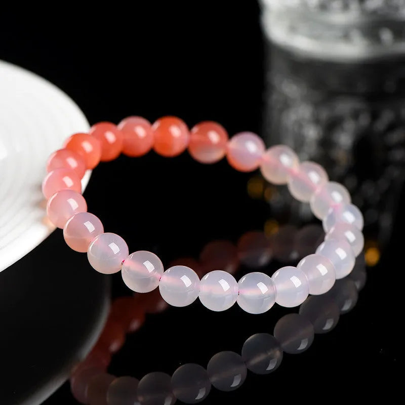Natural gradient Yanyuan agate bracelet showing colour variation on geometric beads in single circle design