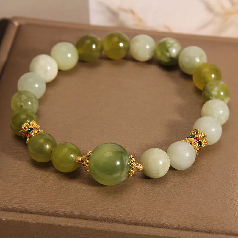 Women's bracelet made of natural green Xiuyan jade in a sweet Mori style.