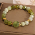 Women's bracelet made of natural green Xiuyan jade in a sweet Mori style.