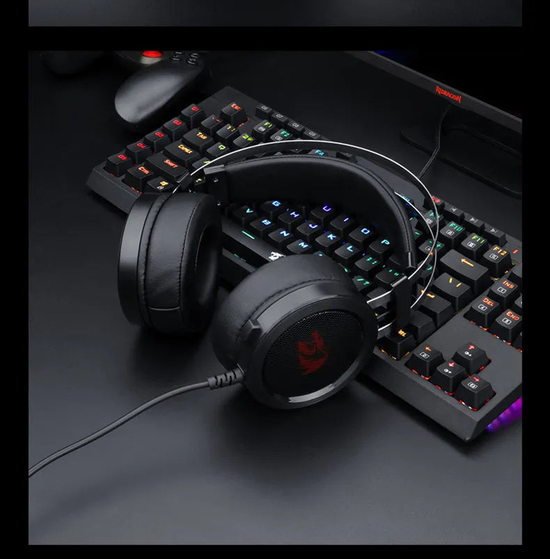 Black wired over-ear PC gaming headset with a 3.5mm plug and long cable.