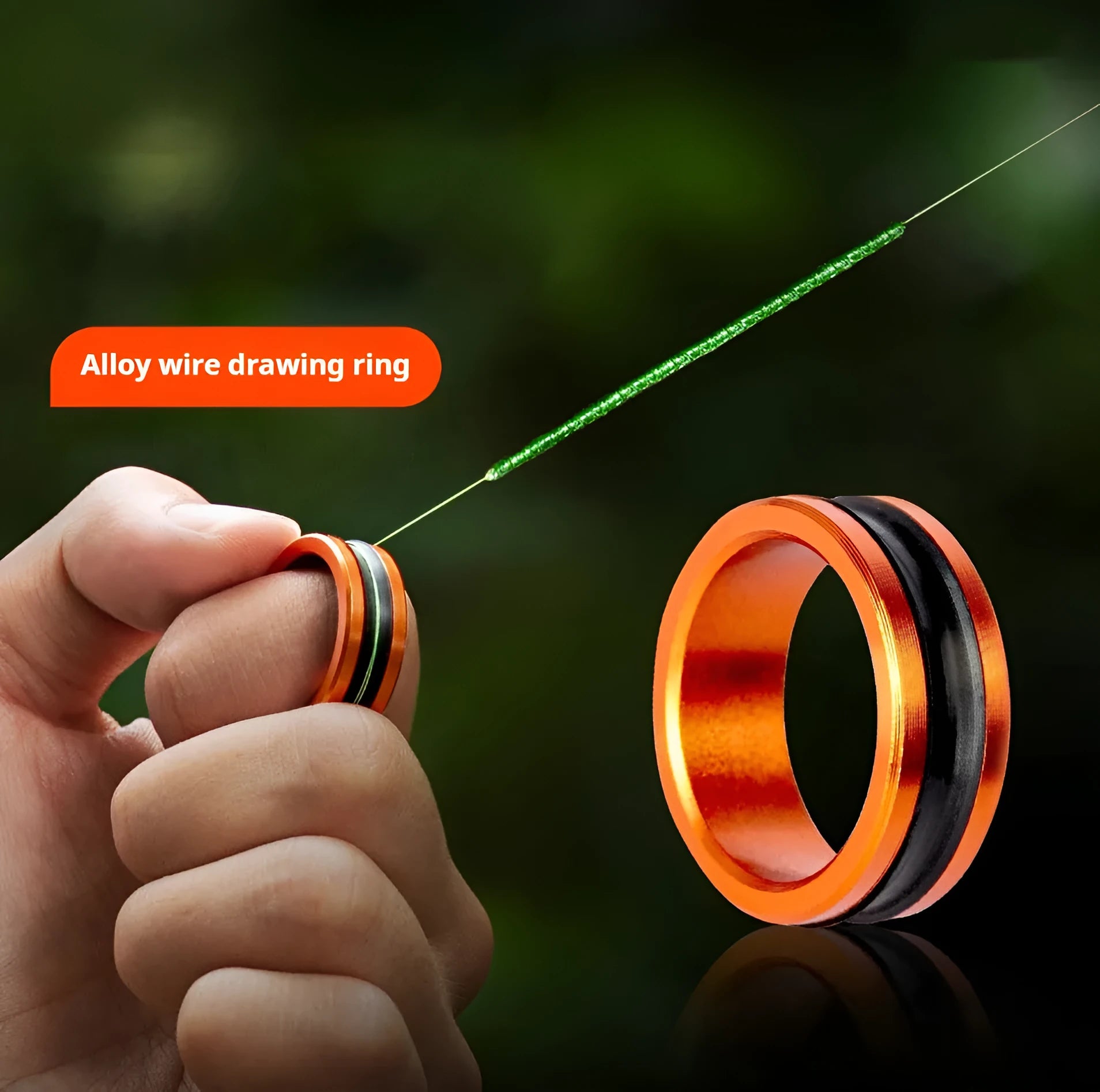 Orange and silver alloy fishing hand guard tool with non-slip surface and pull ring