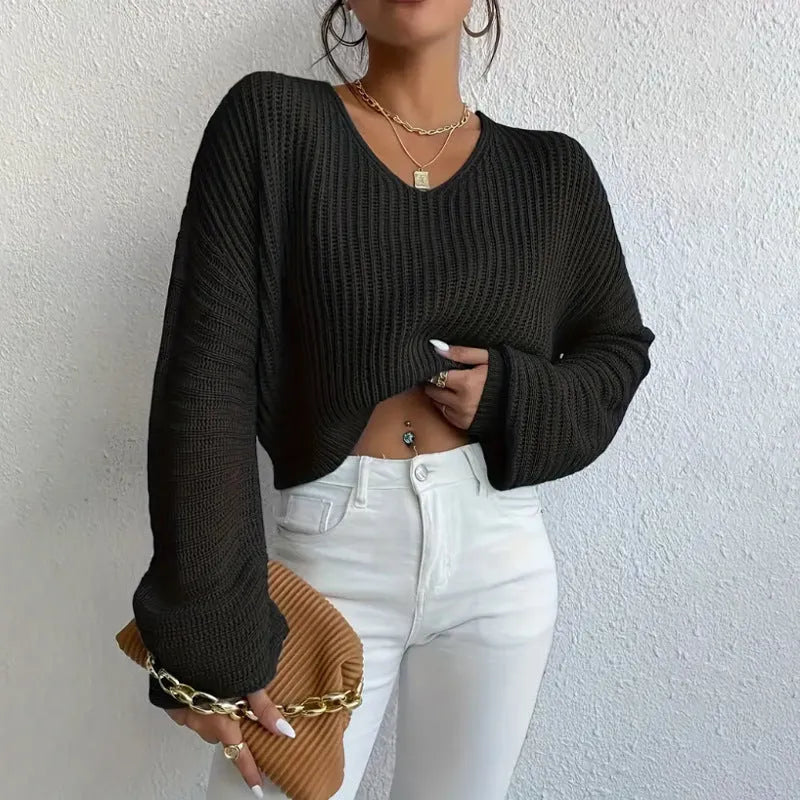 Women's solid colour long sleeve pullover in a loose casual style, shown in one of five available colours.