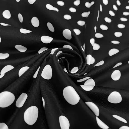 Polka dot dress with square collar, short sleeves, front zipper, and pleated mid-length skirt in multicolour pattern