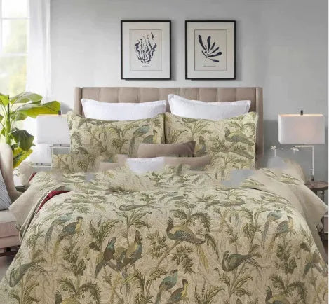 Blue American flower and bird pattern quilted cotton bedspread set on a bed
