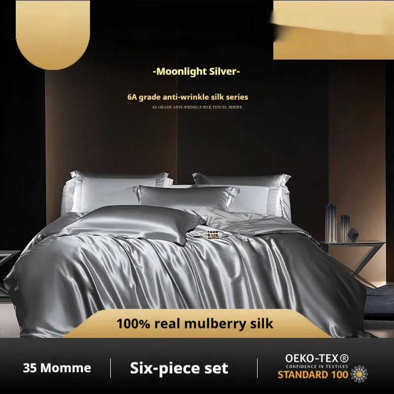 Solid colour silk four-piece quilt cover set shown in a light luxury bedroom setting.