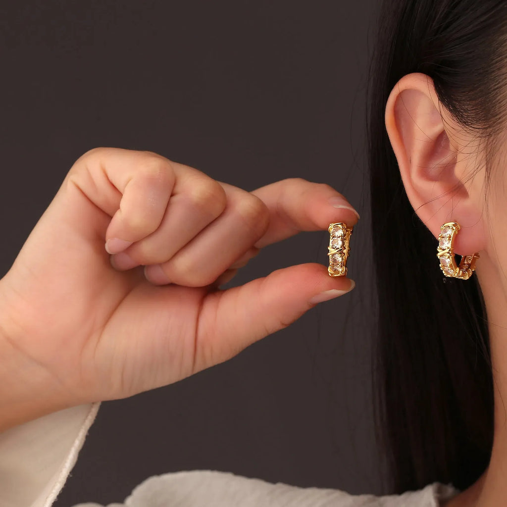 Geometric hexagonal and clover cross design earrings in silver or gold colour.