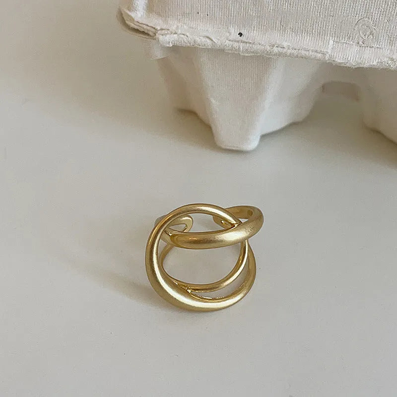 Three-dimensional interlaced geometric open ring in matte metal with gold or silver plating