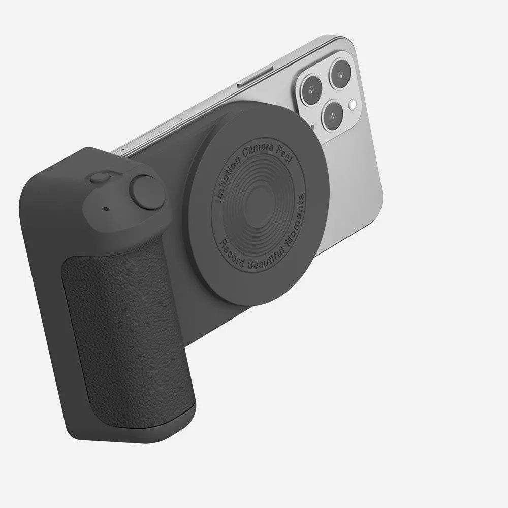 Black magnetic phone camera bracket with PU leather grip and adjustable tilt stand on a table