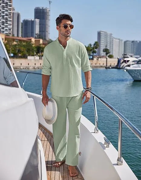 Man wearing a solid colour cotton long sleeve top and matching trousers from a casual suit.