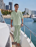 Man wearing a solid colour cotton long sleeve top and matching trousers from a casual suit.