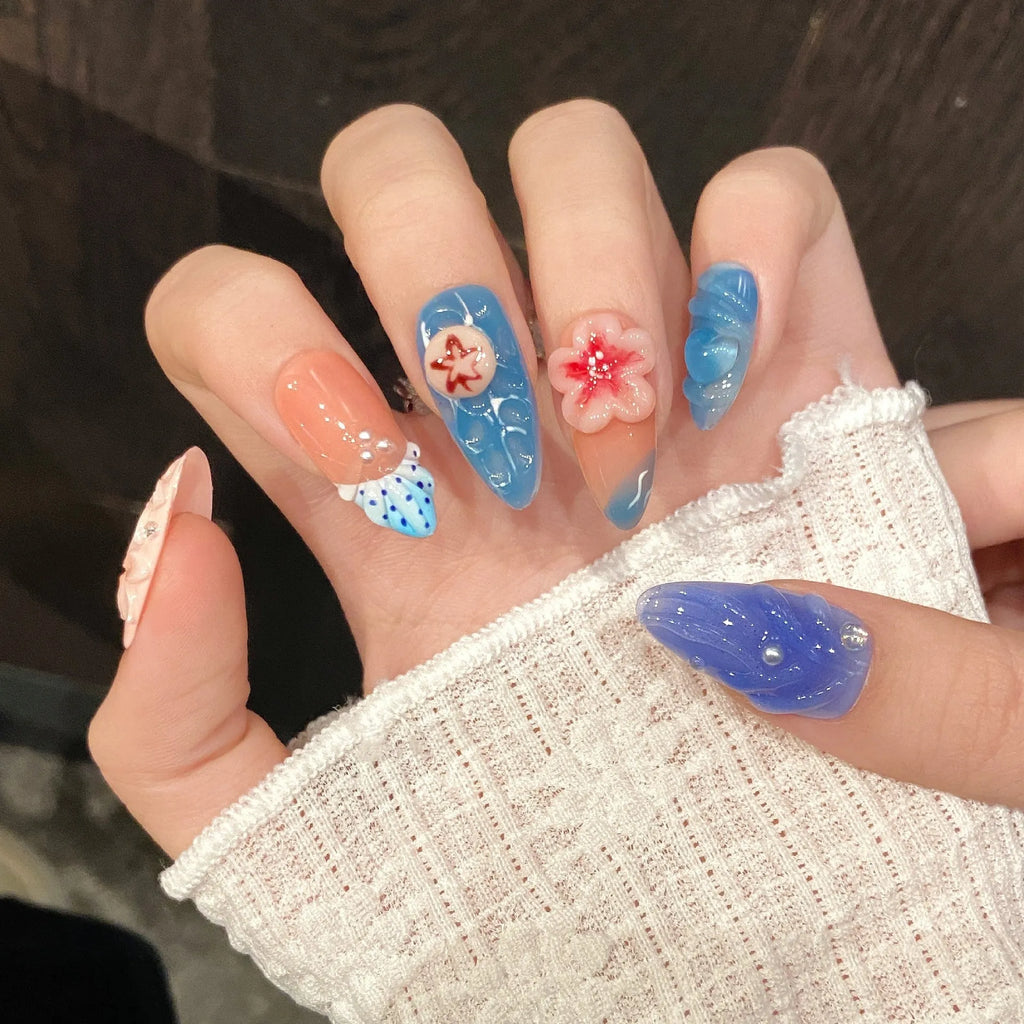 Three-dimensional carved jellyfish plastic armour set in almond nail colour, showing rose and tulip patterns.