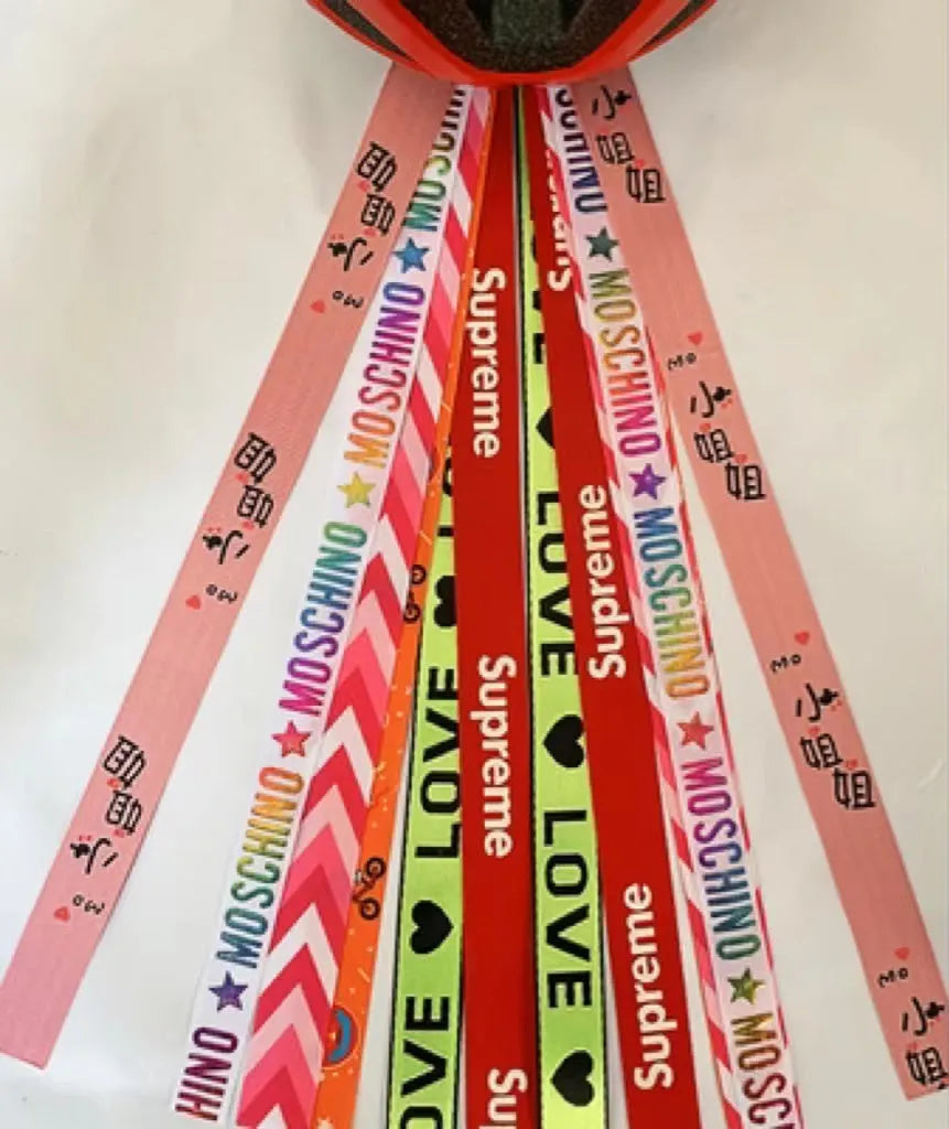 Decorative ribbon streamer for a child's ski or skating helmet in various colour options.