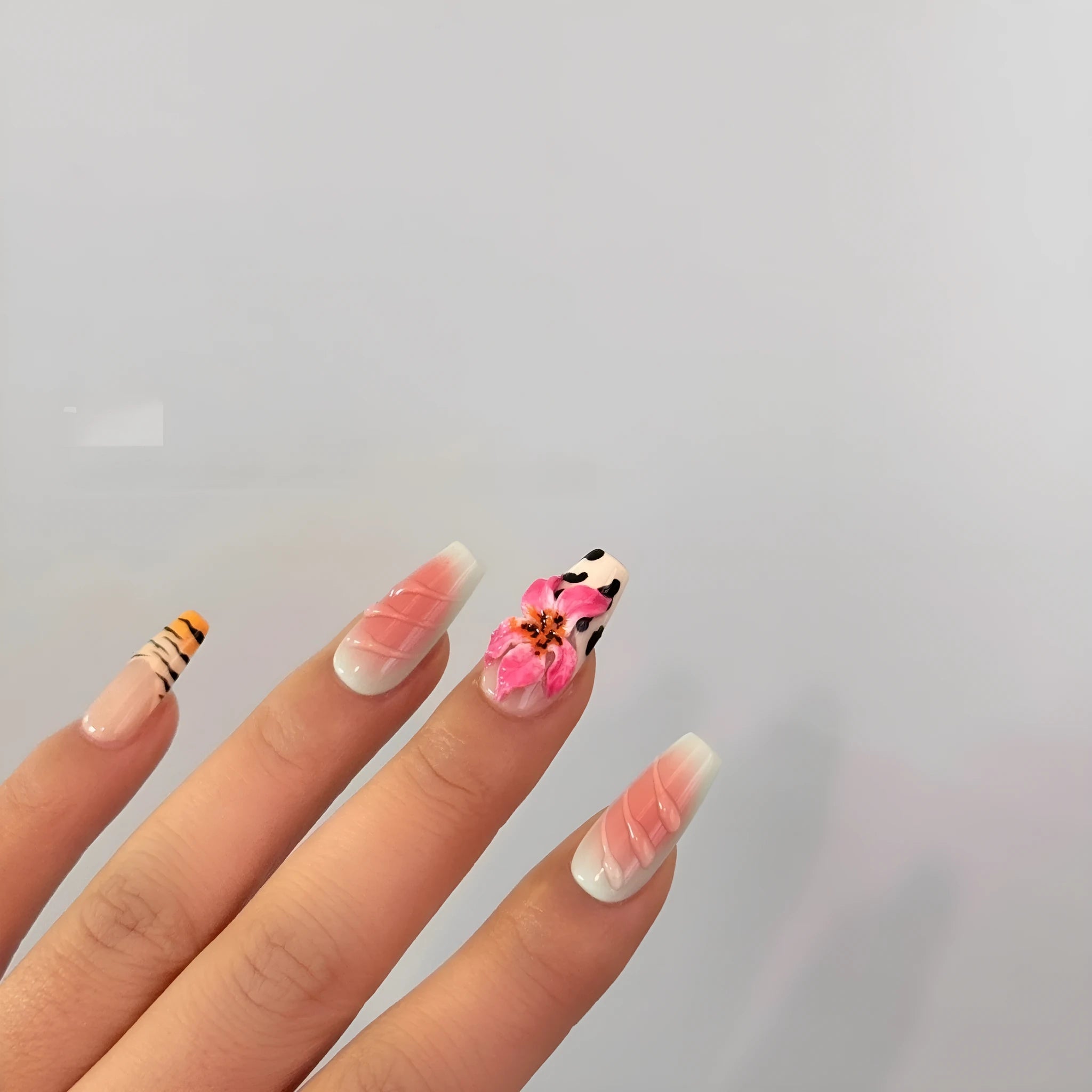 Hand carved zebra pattern nail art with embossed flower and leopard print designs in four size options