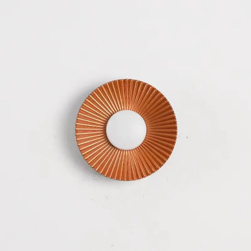 Round aluminium wall lamp with LED light in various colour options including white and gold variants