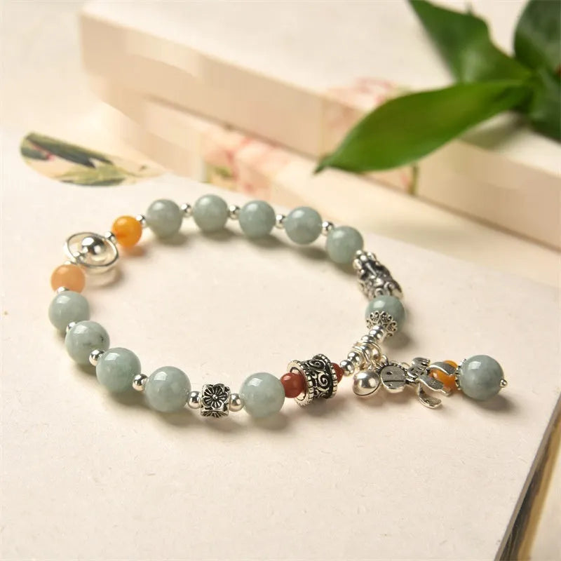 Natural jade vintage bracelet with 8-9mm beads and alloy metal accents on wrist