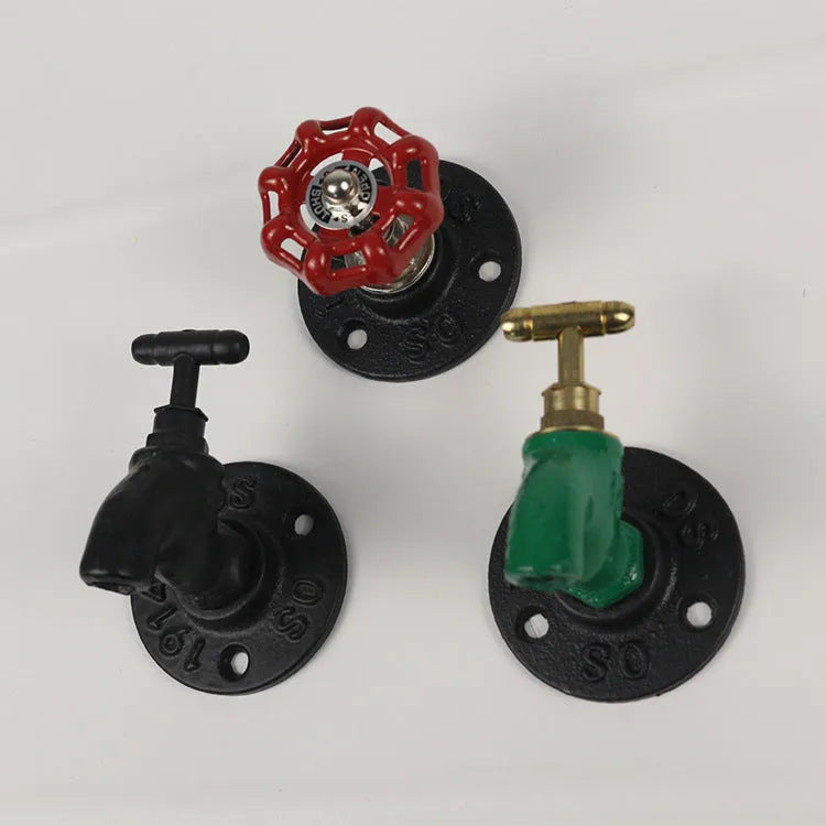 Water pipe style metal towel rack hook in black, green, or red on a white wall
