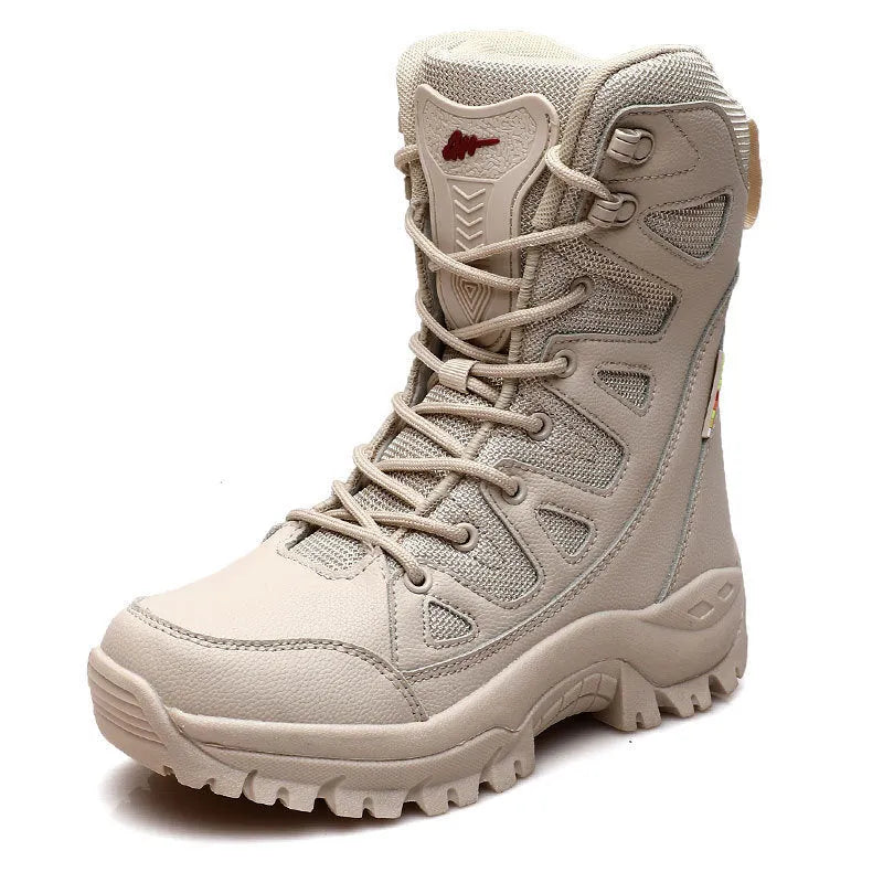 Men's beige cowhide leather hi-top hiking shoes with a platform sole on a rocky outdoor trail.