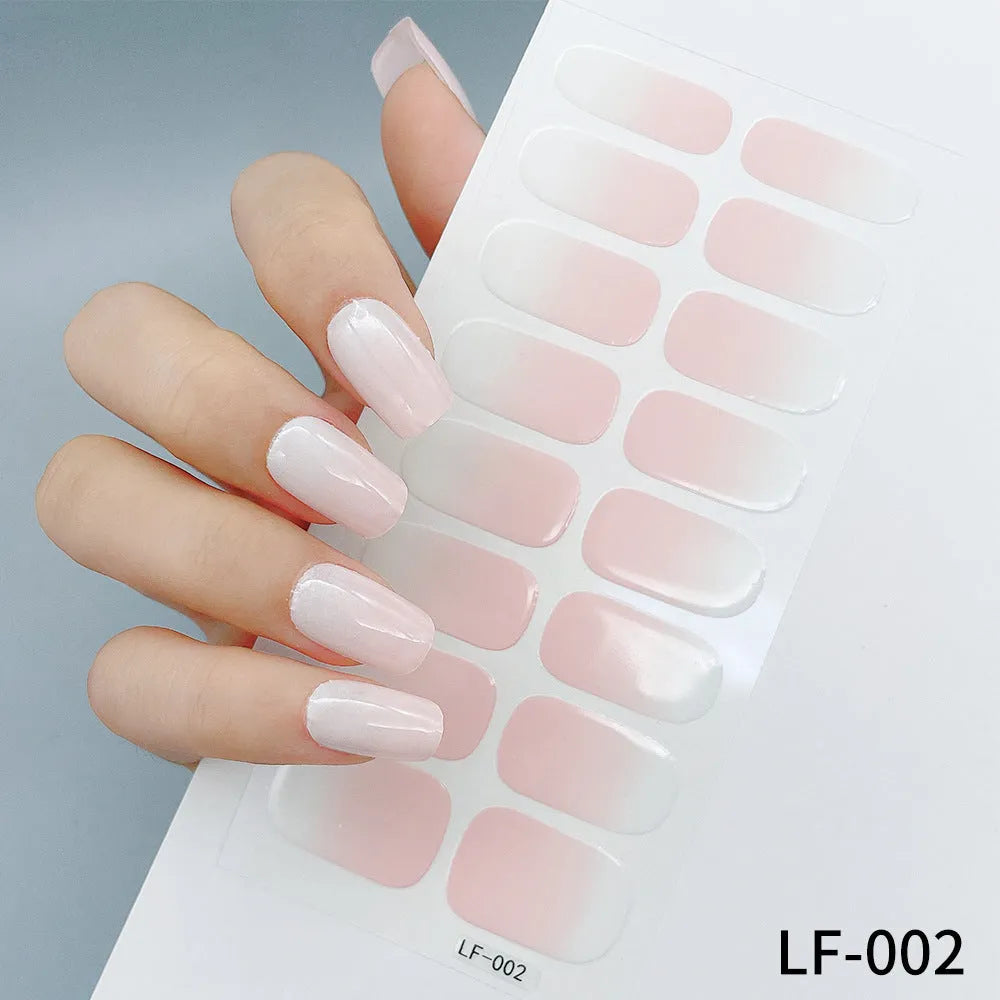 Full coverage nail art stickers sheet with 16 designs including cross, rose, tulip, and cartoon patterns.