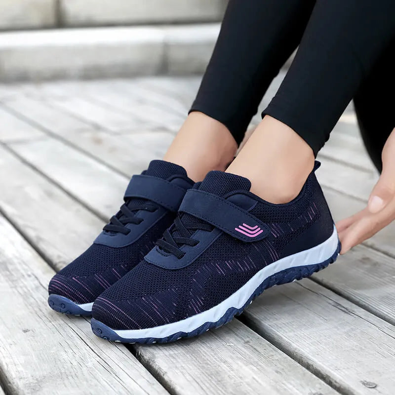 Women's low-top wedge heel shoe in mesh with Velcro strap, shown in a solid colour.