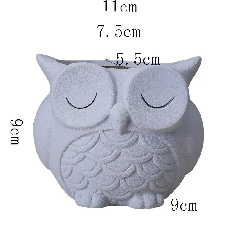 Handmade ceramic owl-design succulent pot in frosted light pink, white, green, or blue, measuring 11cm by 9cm.