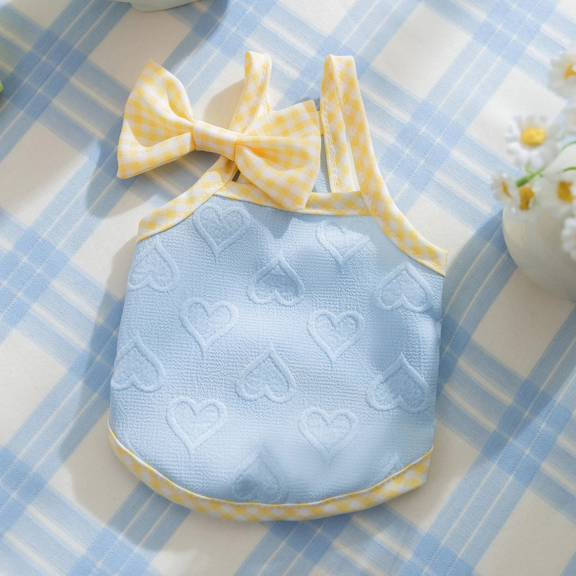 Small dog vest with heart relief texture bow suspenders in elastic polyester fabric