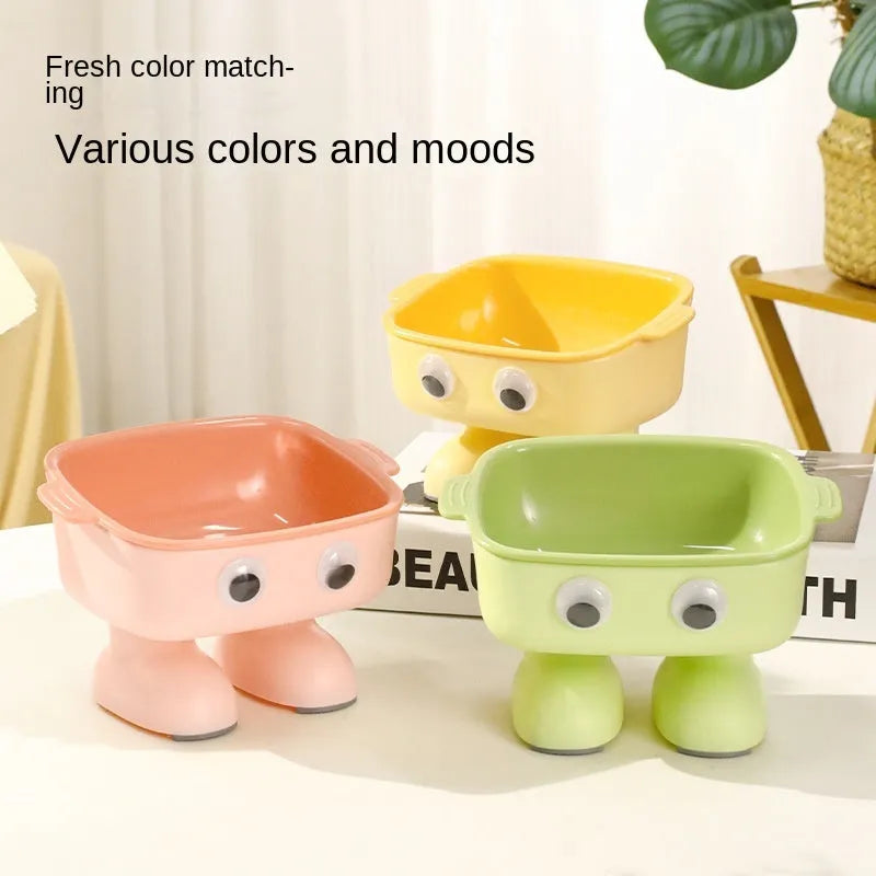Green elevated cat bowl with cartoon robot design and 15° tilt angle