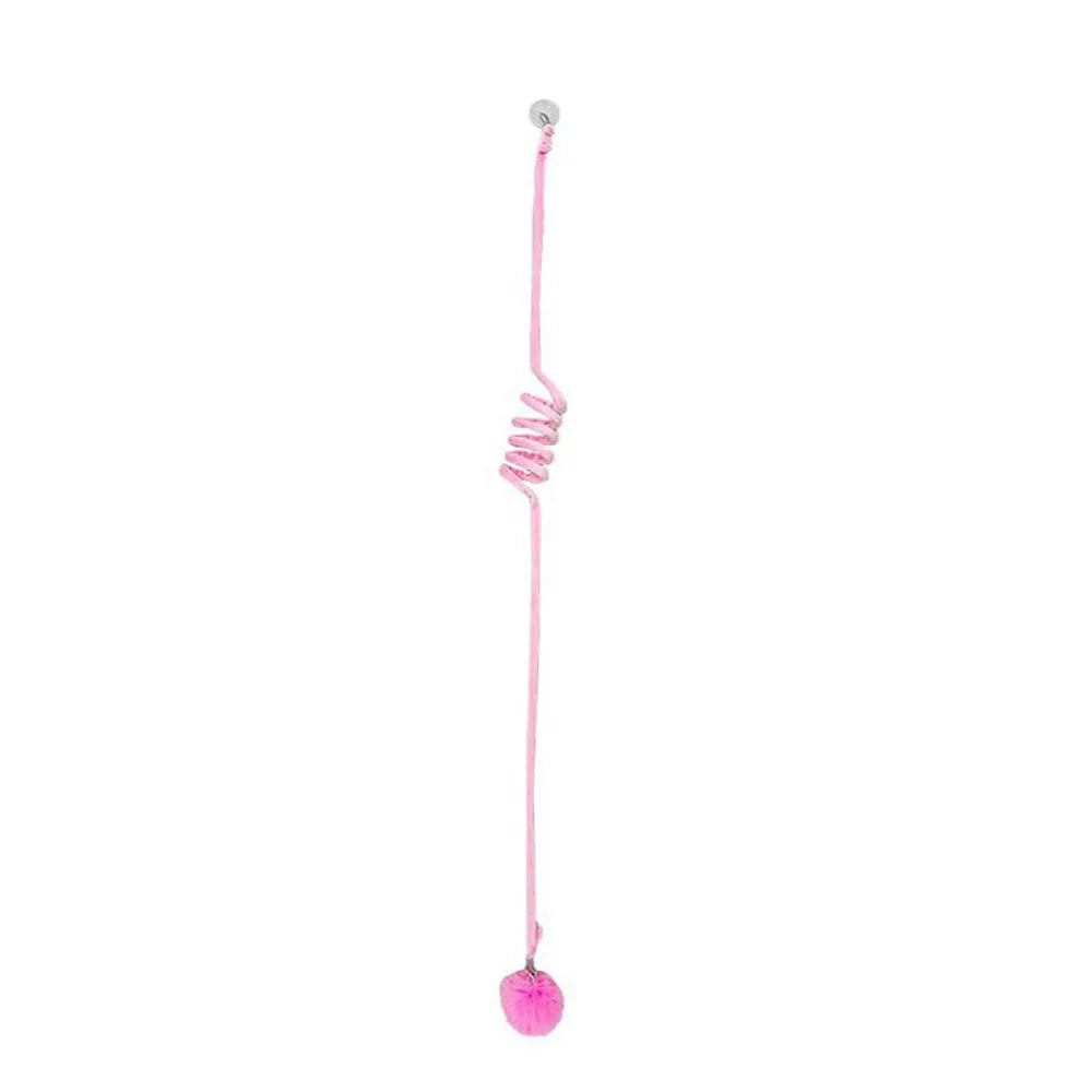 Colourful suction cup cat toy with spring wand and inflatable ball, hanging on a glass door