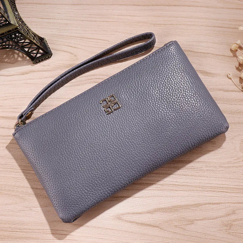 Long 55-inch PU leather phone wallet zipper handbag in solid colour with sewing line detail