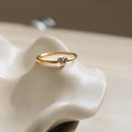 Golden electroplated stainless steel ring in heart or oval shape available in sizes 5 to 8