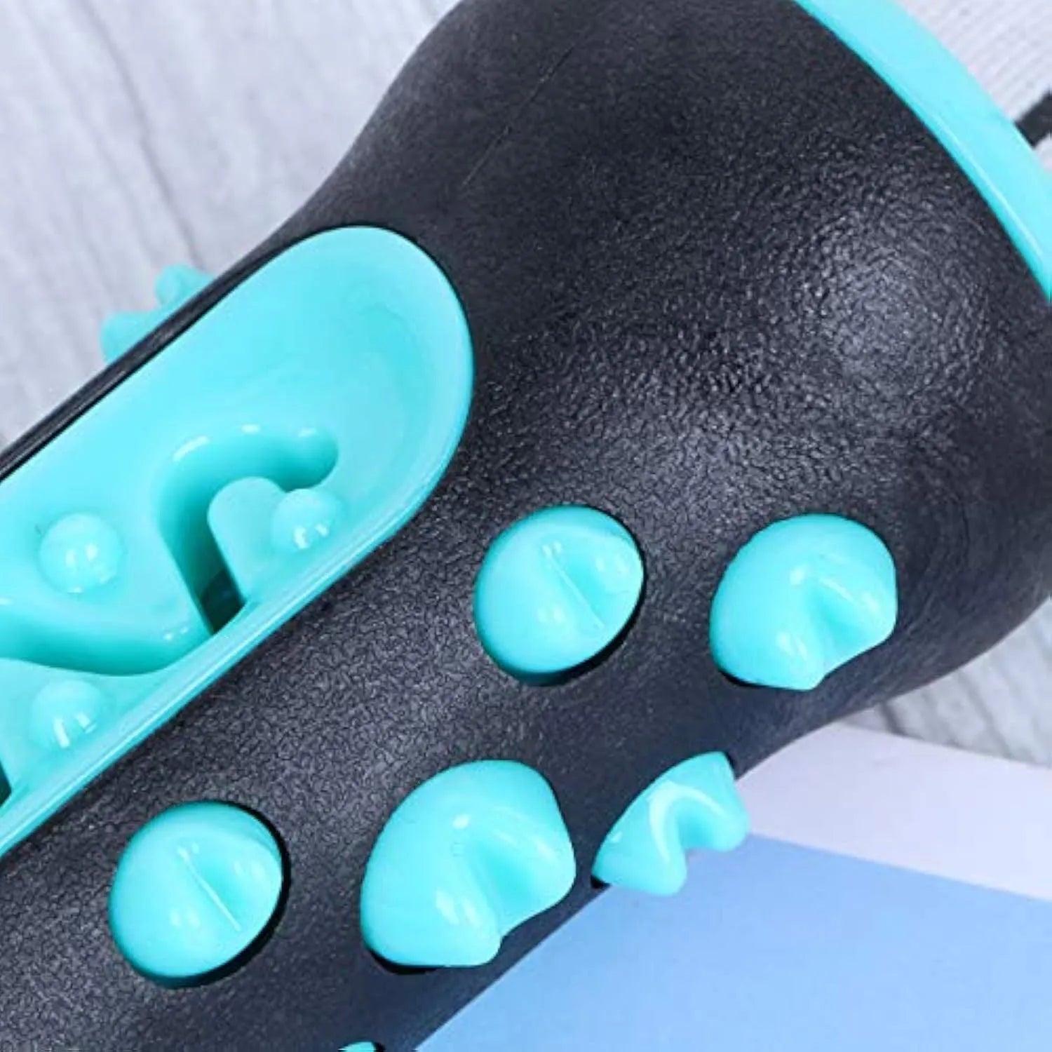 Natural rubber dog toothbrush chew toy in blue colour showing textured dental cleaning surface