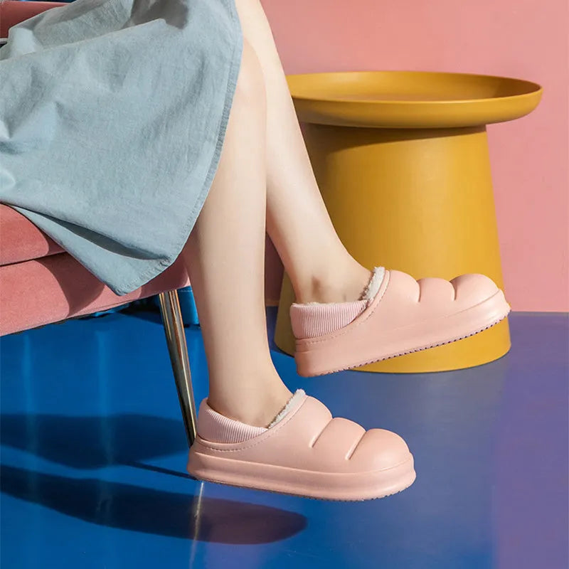 Women's waterproof EVA garden slippers in assorted colours with plush lining and non-slip soles.