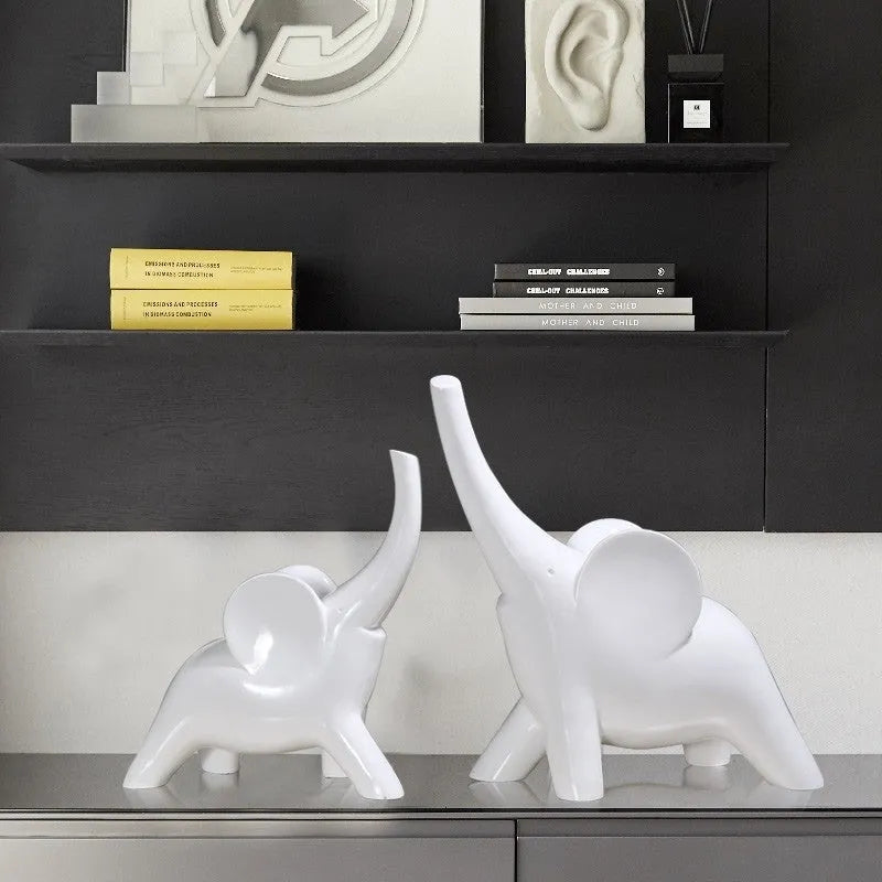 Rose gold and white resin elephant ornaments in large and small sizes displayed singly and as pairs