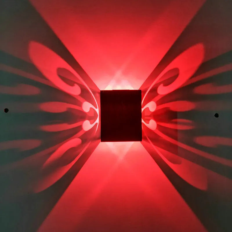 Modern aluminium butterfly-shaped LED wall lamp with multi-colour remote control.