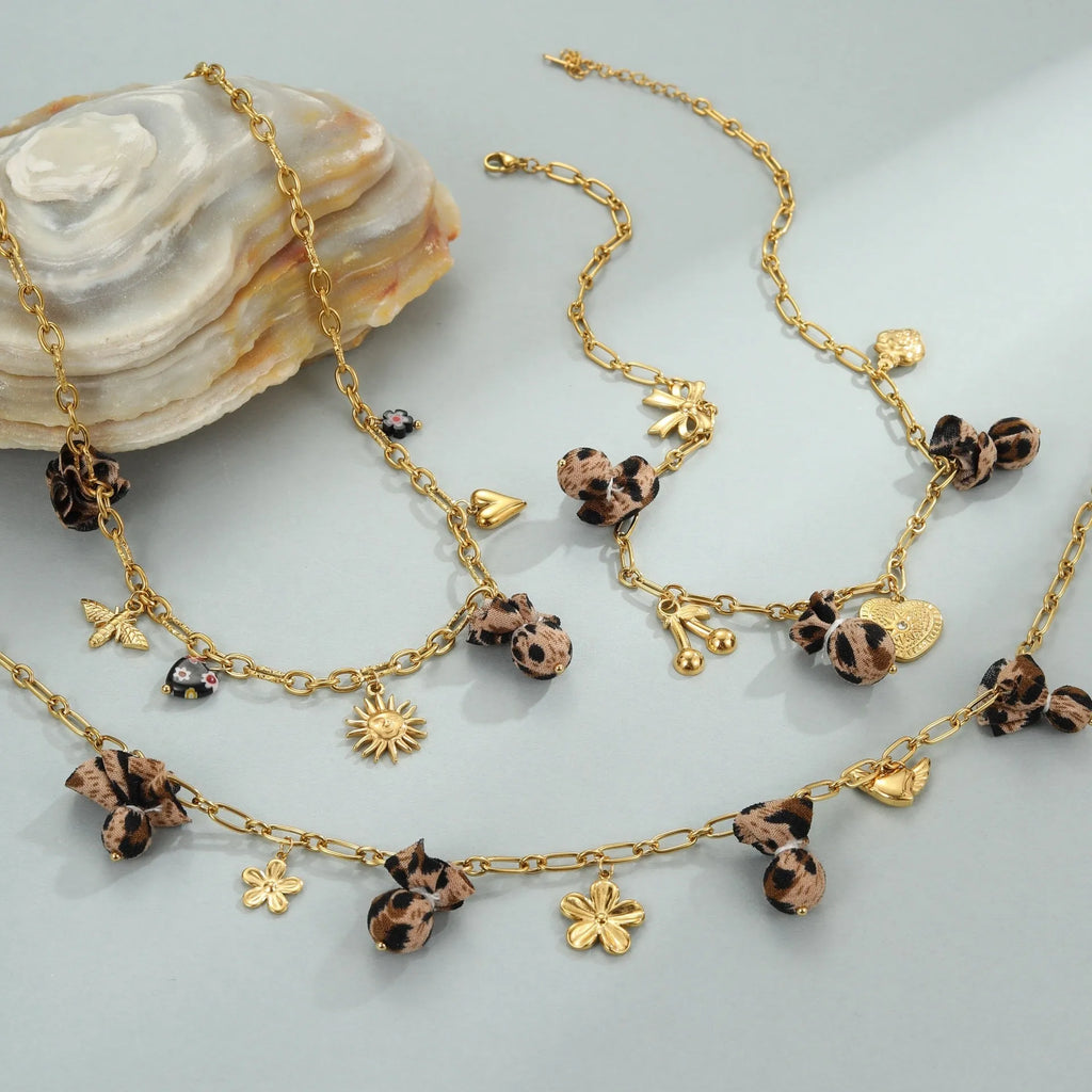 Women's stainless steel necklace with geometric leopard, heart, and flower pendant designs on 41-50cm chain