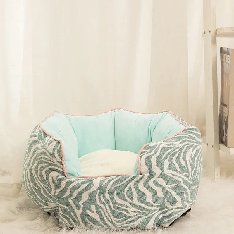 Blue octagonal pet bed for small dog with high sides and removable interior mat.