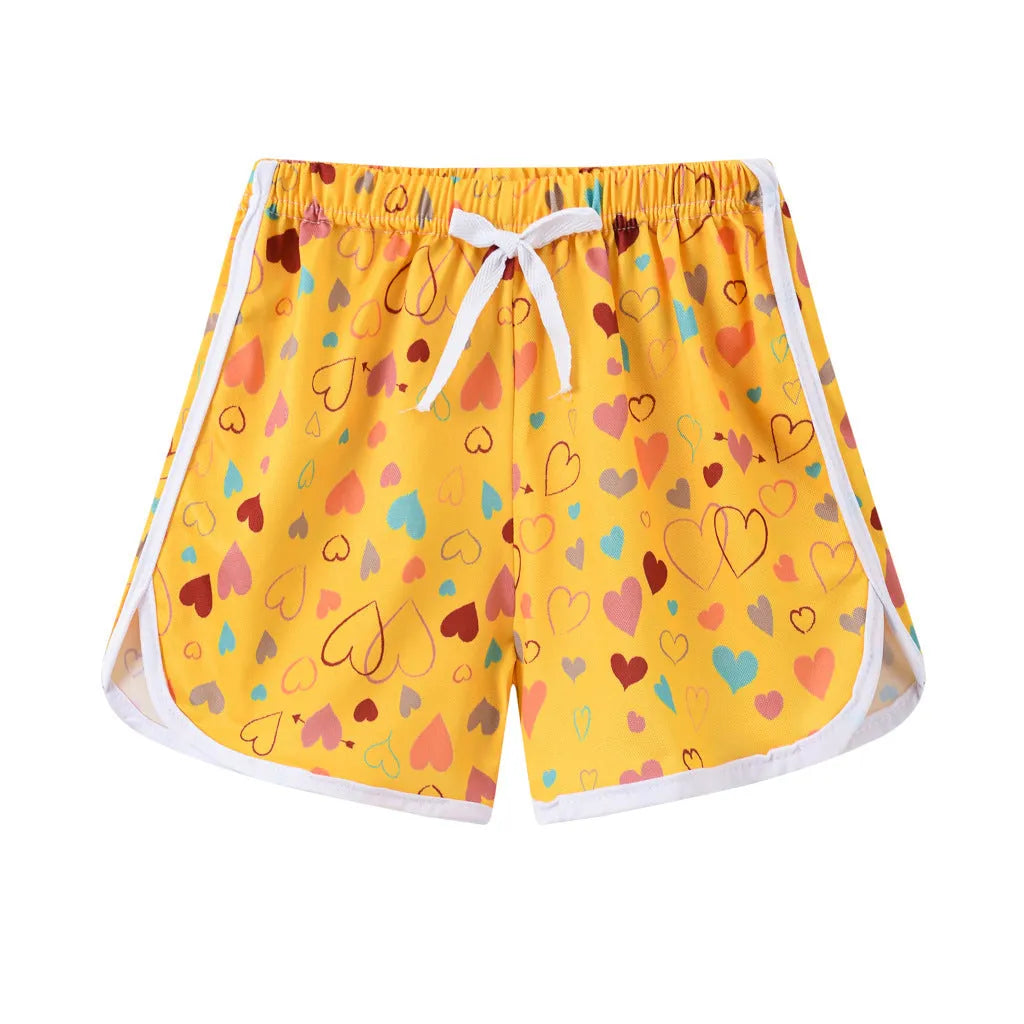 Children's polyester beach shorts in multiple prints and solid colours with size range 100-140cm