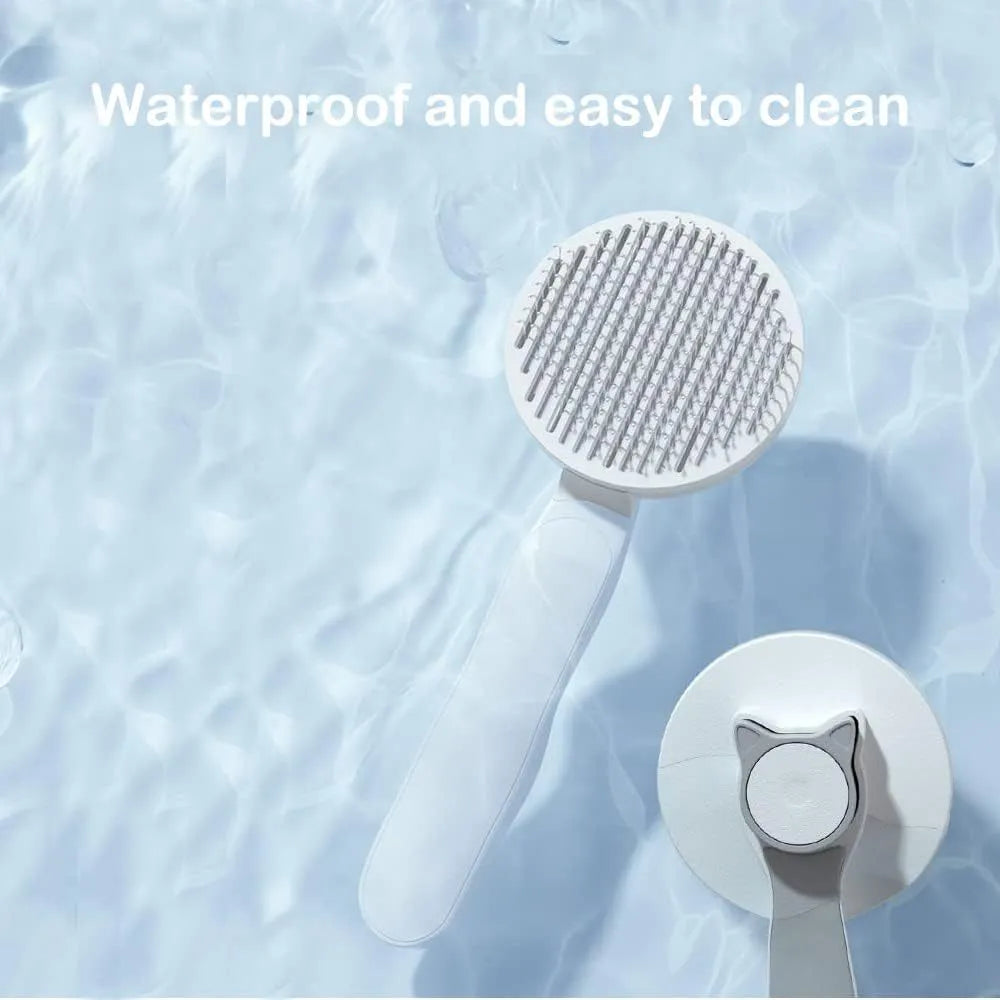 Blue self-cleaning cat grooming brush with rubber handle and round-tip needles.