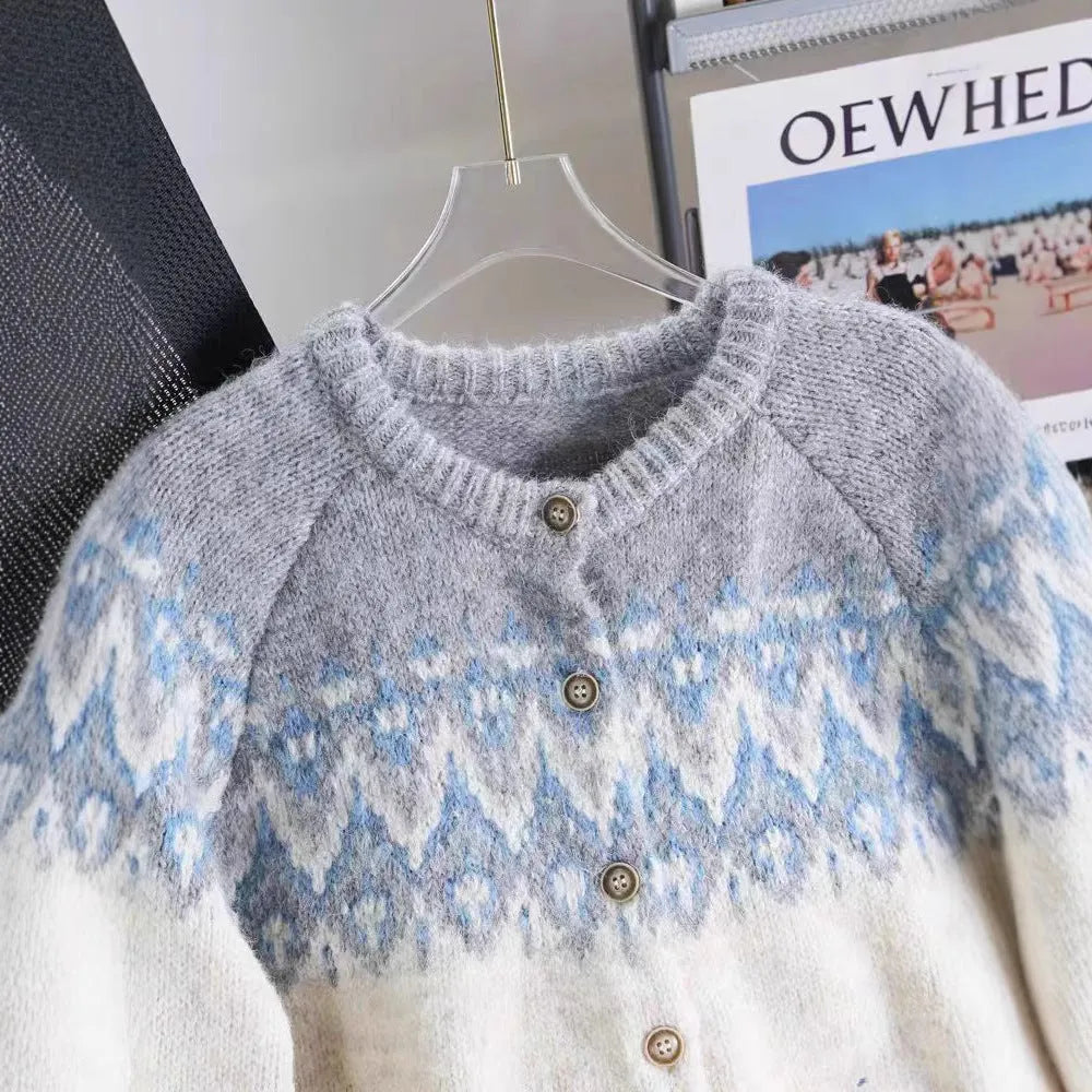 Women's loose-fit jacquard knit sweater coat in milky white, shown with long sleeves and textured pattern.