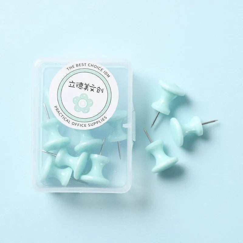 Plastic push pins in cherry blossom pink, mint green, and lavender colours, showing both large and small sizes in a box.