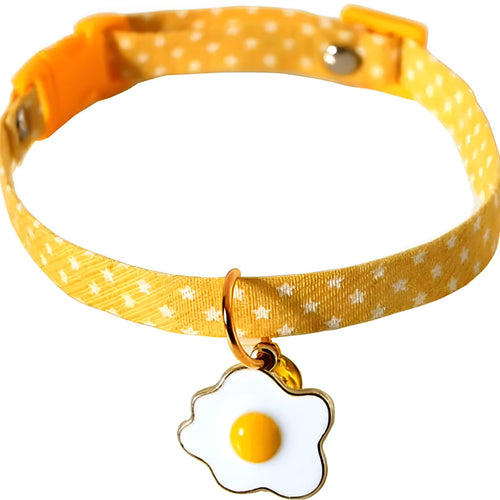 Green adjustable cat collar with a silver bell and a matching bow tie on a white background
