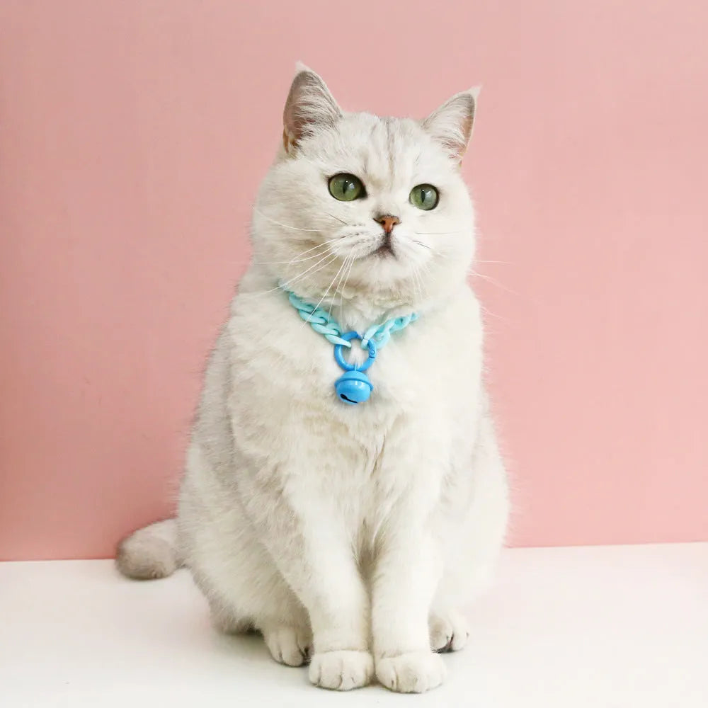 Adjustable plastic pet collar in macaron candy colours on a white background.