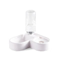 White automatic pet water fountain for cats and dogs on a floor.