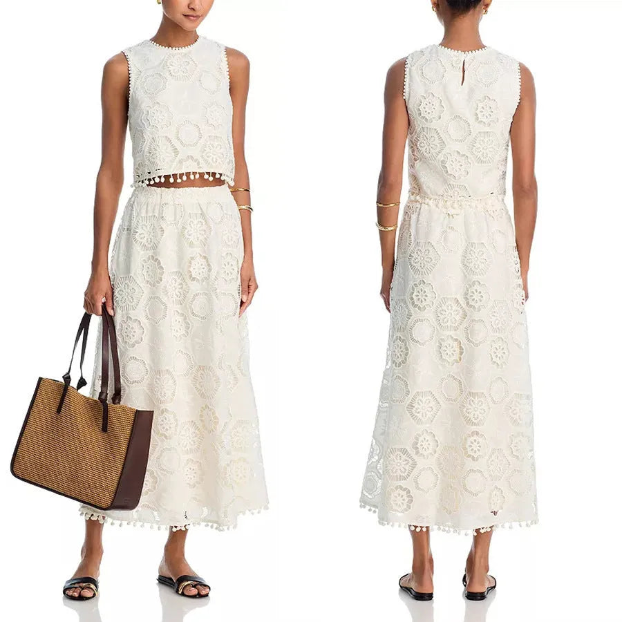 White women's retro style suit set with sleeveless top and embroidered long skirt on hanger