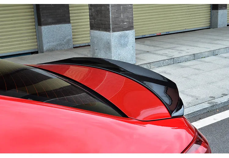 Mazda 3 Axela Exela large rear spoiler in bright black finish with fixed wind surround design