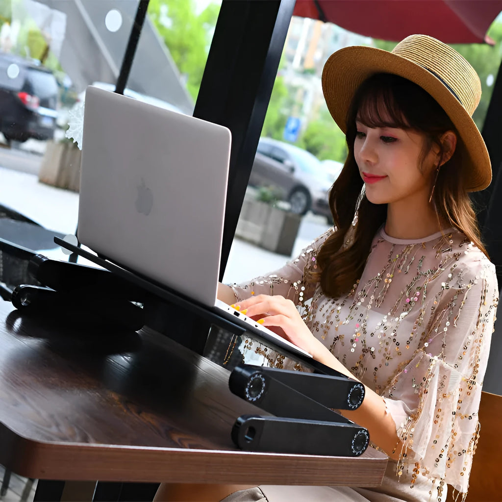 Red folding computer desk with cooling fan and extension straps for laptop use on beds