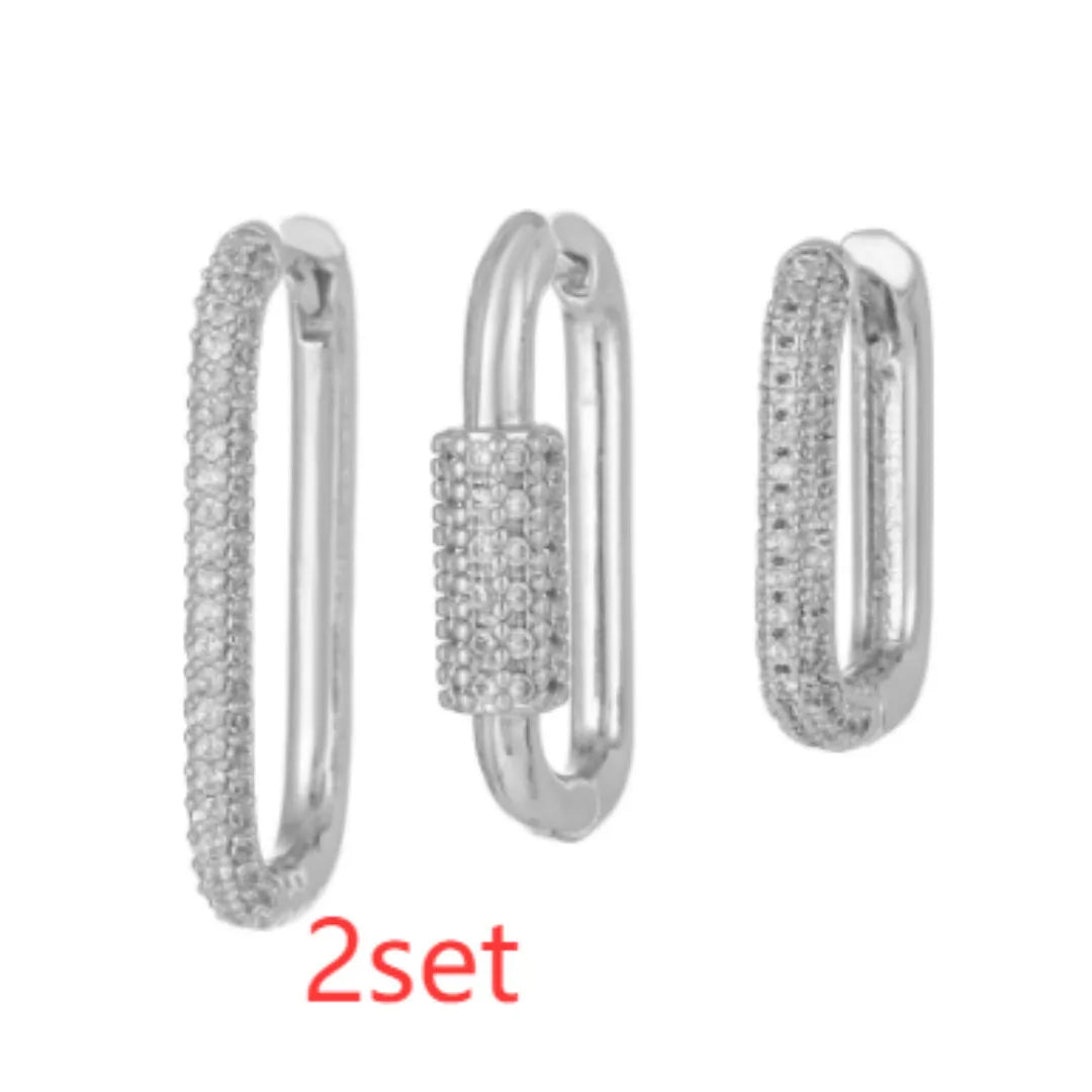 Three geometric ear clips with micro inlaid zircon in gold and white metal colours