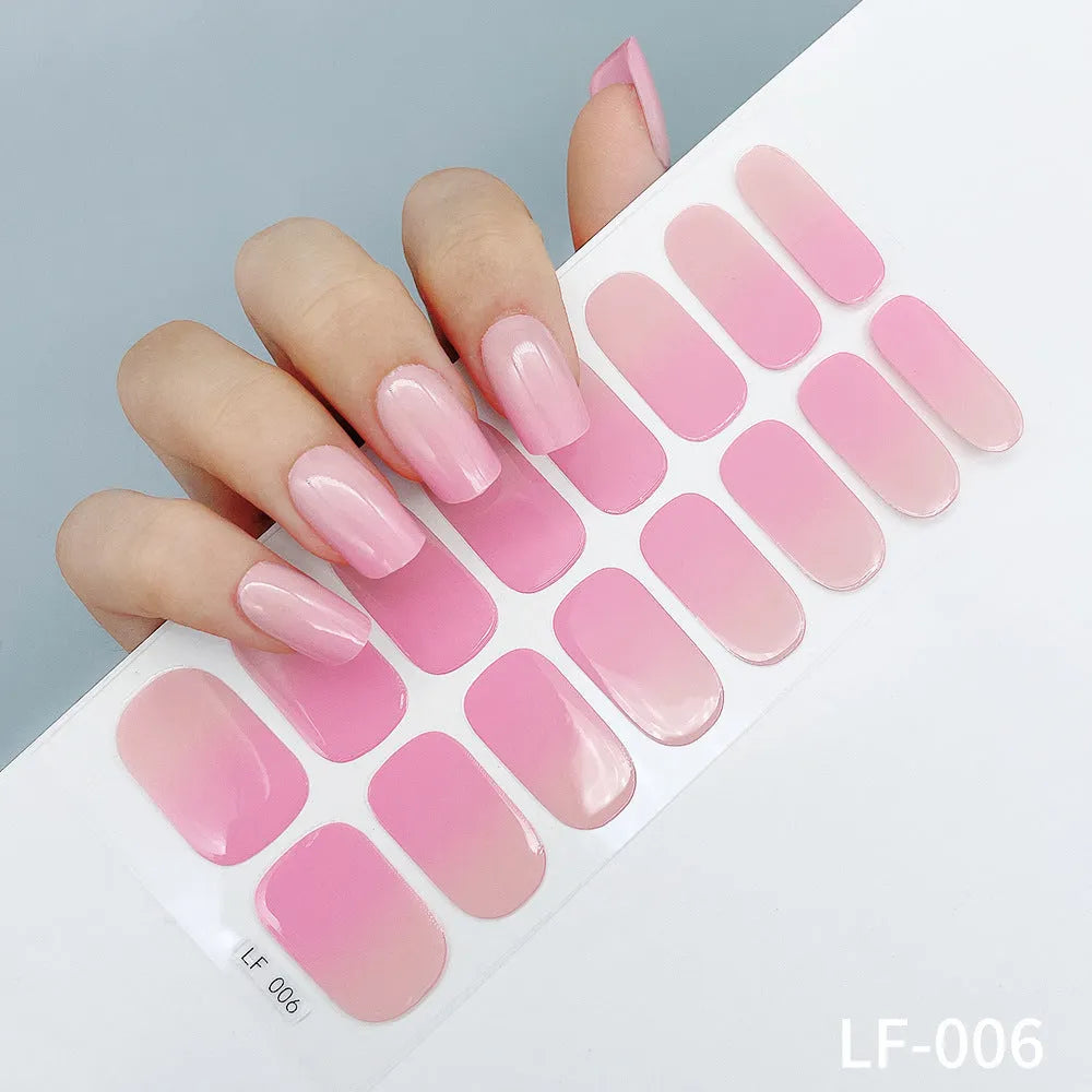 Full coverage nail art stickers sheet with 16 designs including cross, rose, tulip, and cartoon patterns.