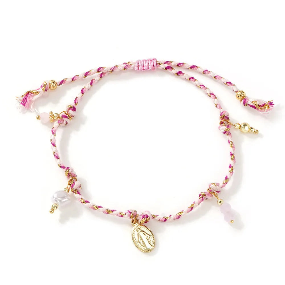 Hand-woven ethnic style bracelet made from colourful braided rope with carrying strap detail