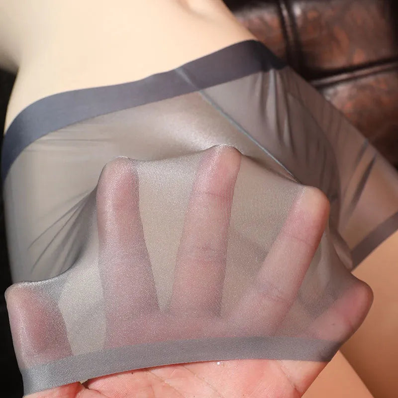 Men's ultra-thin transparent ice silk boxer underwear laid flat, showing light gray colour.