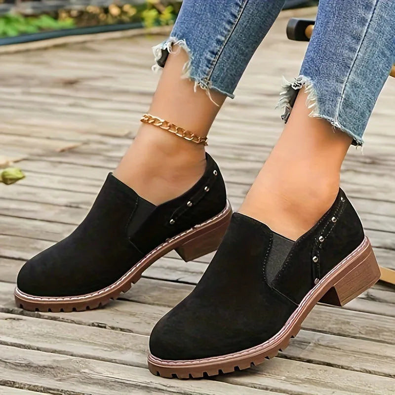 Women's light brown suede ankle boots with elastic band and thick low heel on rubber sole
